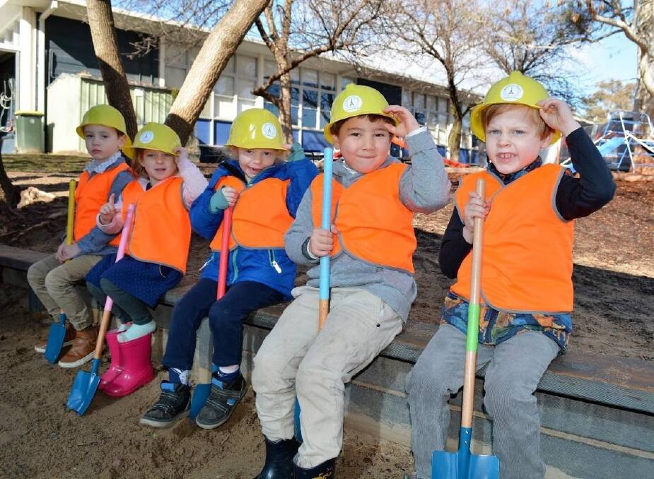 Children at the French Australian Preschool in Canberra celebrate the turning of the first sod on the new facilities. Pictured are Eamon O’Callaghan, Leila Muir, Zoe Milligan, Etienne Maxwell and Léo Travouillon. Photo: Supplied