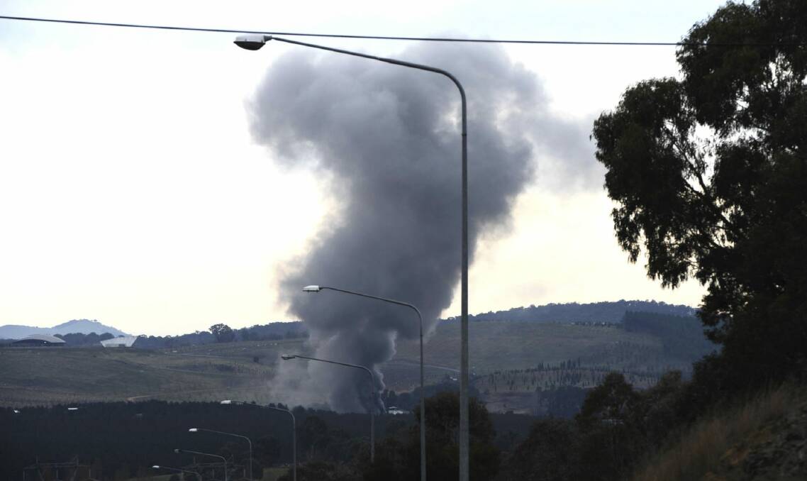 A fire at the National Zoo and Aquarium seen from the Tuggeranong Parkway. Photo: Graham Tidy