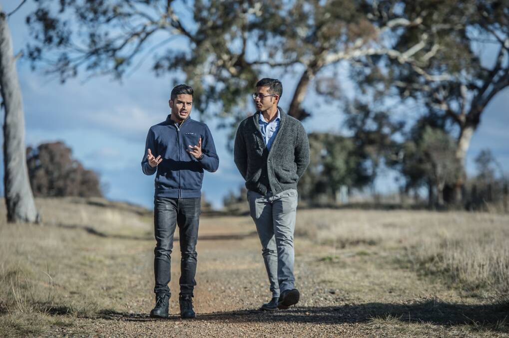 Yatin Malik, of India, and  Chandan Paul, of Bangladesh, have had their hopes of permanent residency in Australia dashed by ACT changes to visa rules. Photo: Karleen Minney