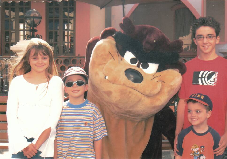 On a family holiday at Movieworld in 2004 (from left) Courtney, Zachary, Brodie and Kris. Photo: Courtesy of the Topic Family