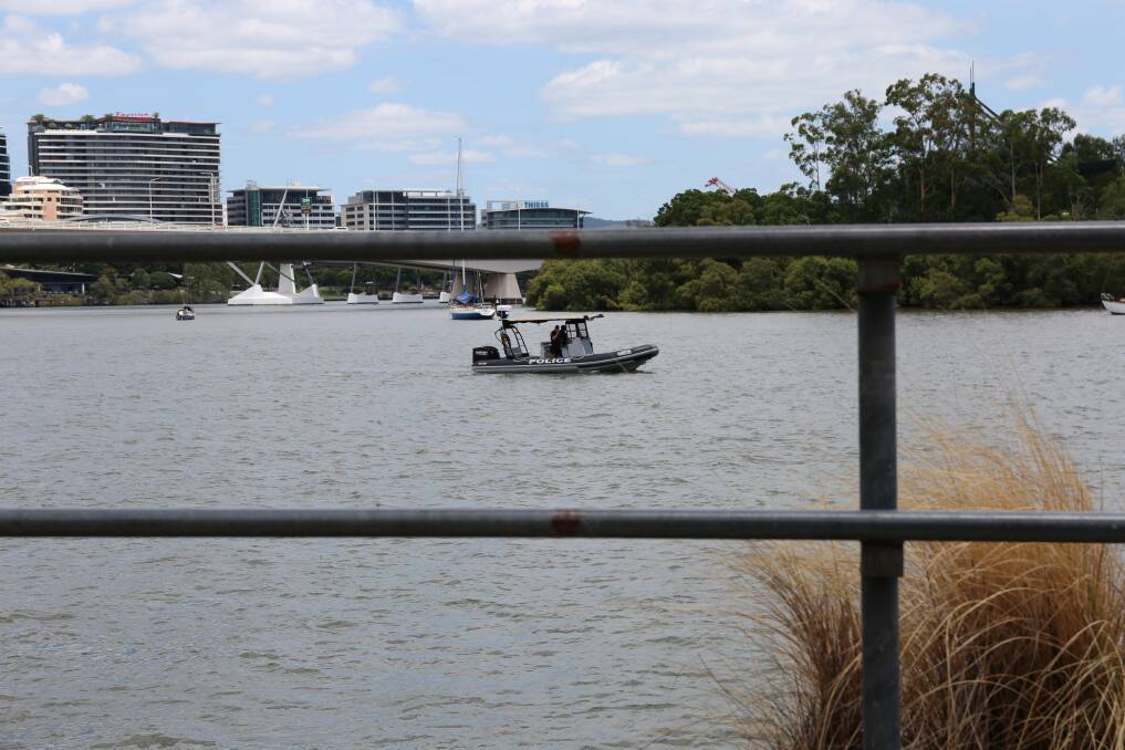 Water police boats and divers returned to the Brisbane River on Monday to search for Matt Jarvis. Photo: Jocelyn Garcia