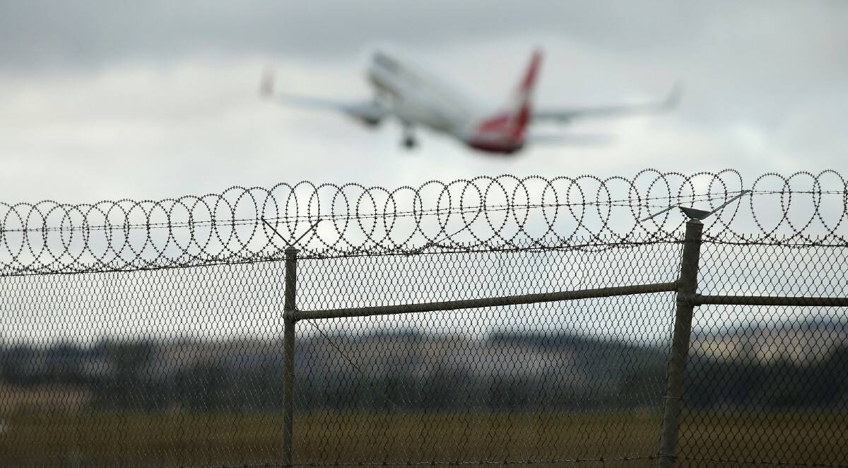 Criminals hired to work at Australian airports pose a major threat to security, a new report has found. Photo: Patrick Scala