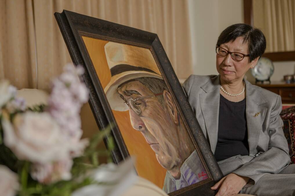 Adjunct Associate Professor of Economics Dr Suiwah Leung, with a painting by her daughter Emily Dean, of her late husband Ron Dean.
 Photo: jamila_toderas