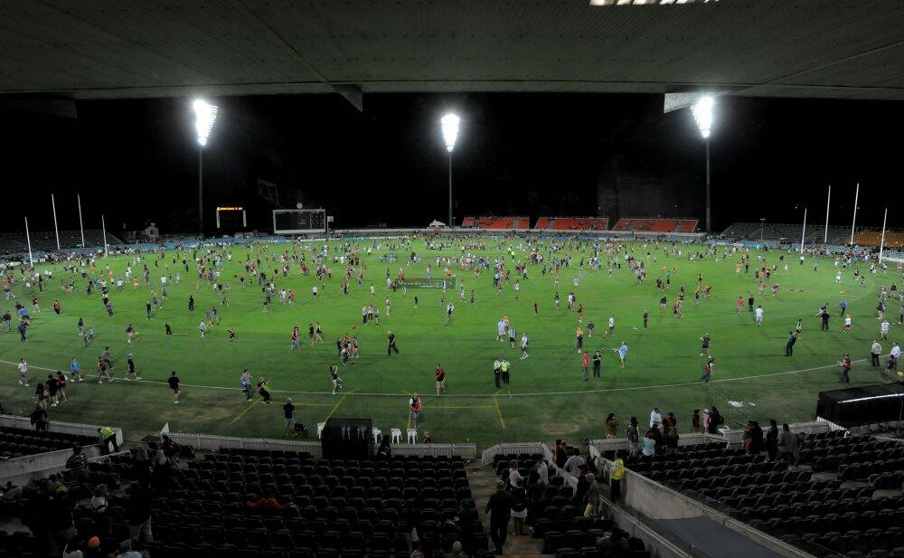 Fans after a pre-season game at Manuka Oval.  Photo: Graham Tidy