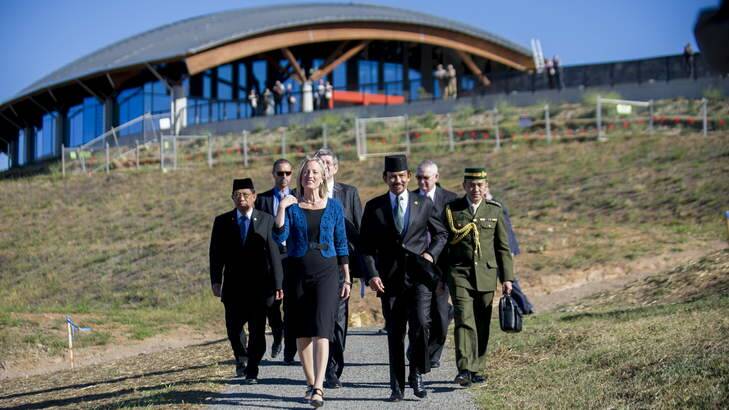 ACT Chief Minister Katy Gallagher and the sultan of Brunei, Hassanal Bolkiah, arrive at the National Arboretum to plant a tree. Photo: Rohan Thomson