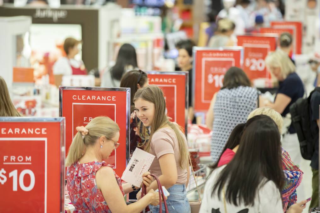 Shoppers browse the cosmetics section of Myer at the Canberra Centre during the Boxing Day sales on Wednesday. Photo: Sitthixay Ditthavong