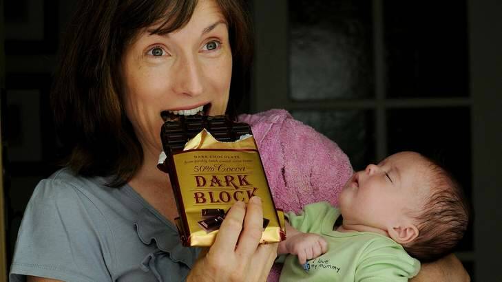 Karen Costello with her 11-week-old daughter Claire Connor enjoys some dark chocolate. Photo: Colleen Petch