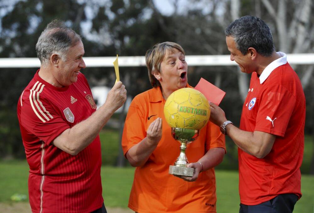 World Cup fever pitch hit Canberra as diplomats from the three nations competing against Australia gathered for a kick and a giggle at Yarralumla Oval. From left, Spanish ambassador Enrique Viguera, Netherlands ambassador  Annemieke Ruigrok and Chile's charge d'affaires Carlos Moran. Photo: Graham Tidy