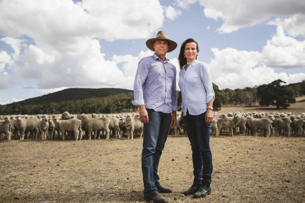 Local farmers John Reardon and Tina Freund stand on their property, just over a ridge from the range. Photo: Jamila Toderas