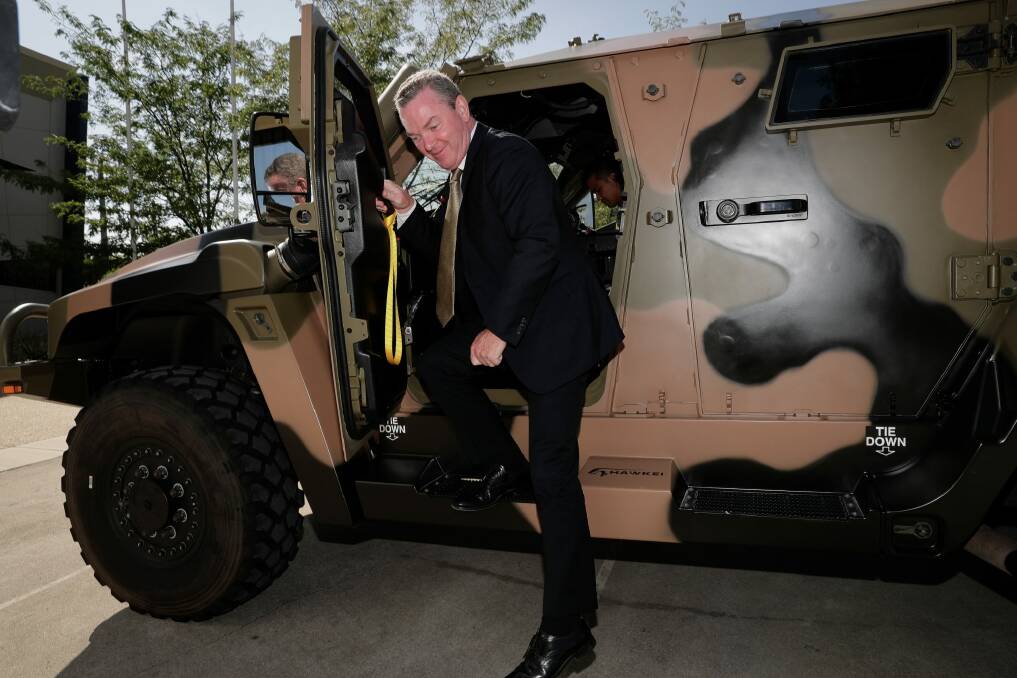 Then defence industry minister Christopher Pyne in a Hawkei earlier this year. Photo: Alex Ellinghausen