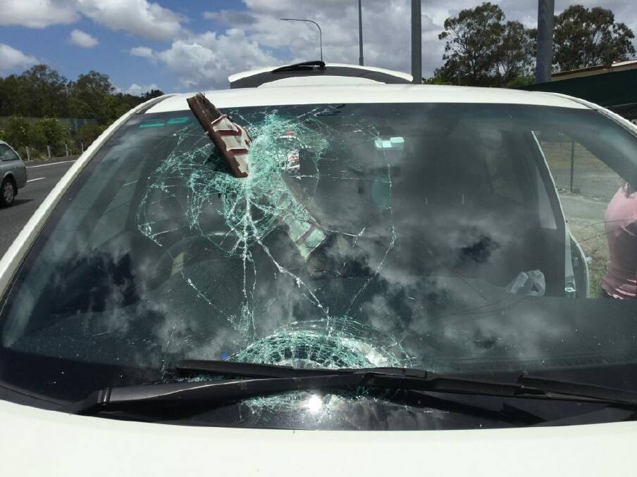 A woman has escaped without injury after a plate has smashed through the windscreen of her car in Queensland. Photo: Queensland Police Service