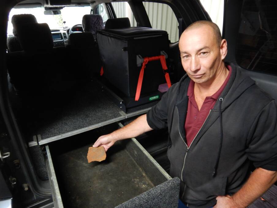 Steve initially stashed the rock he pilfered from Uluru in this tray in the back of his 4WD. Photo: Tim the Yowie Man