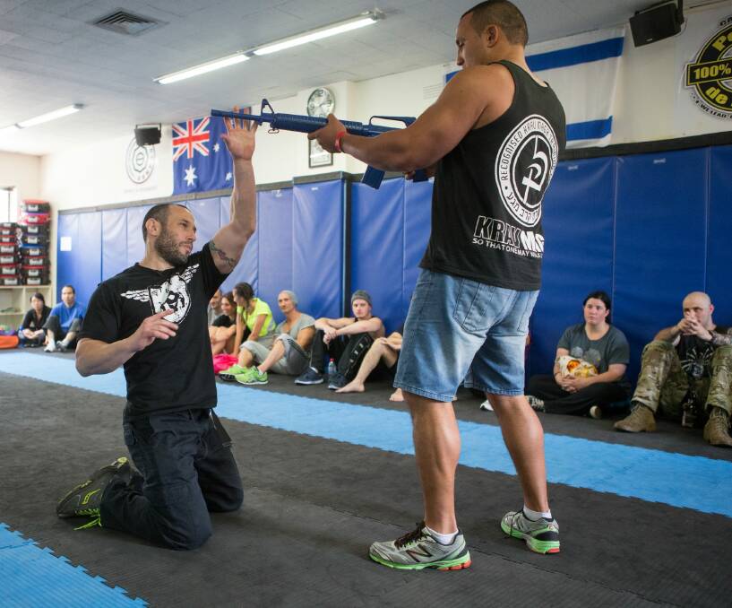 Lior Offenbach offers tip on disarming an attacker after a Krav Maga class at IDF Training in Caulfield. Photo: Jason South