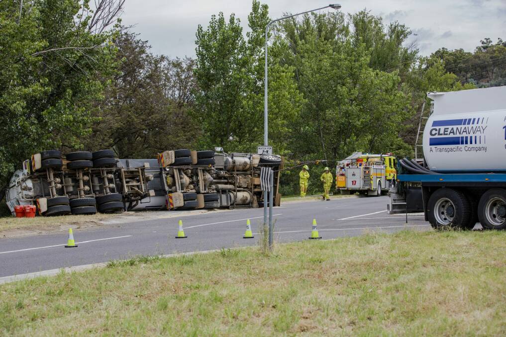 Sewage waste truck tips over on Morshead Drive on Thursday morning.

The Canberra Times

Photo Jamila Toderas Photo: Jamila Toderas