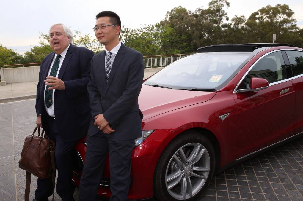 Clive Palmer and senator Zhenya 'Dio' Wang outside Parliament House. Photo: Andrew Meares