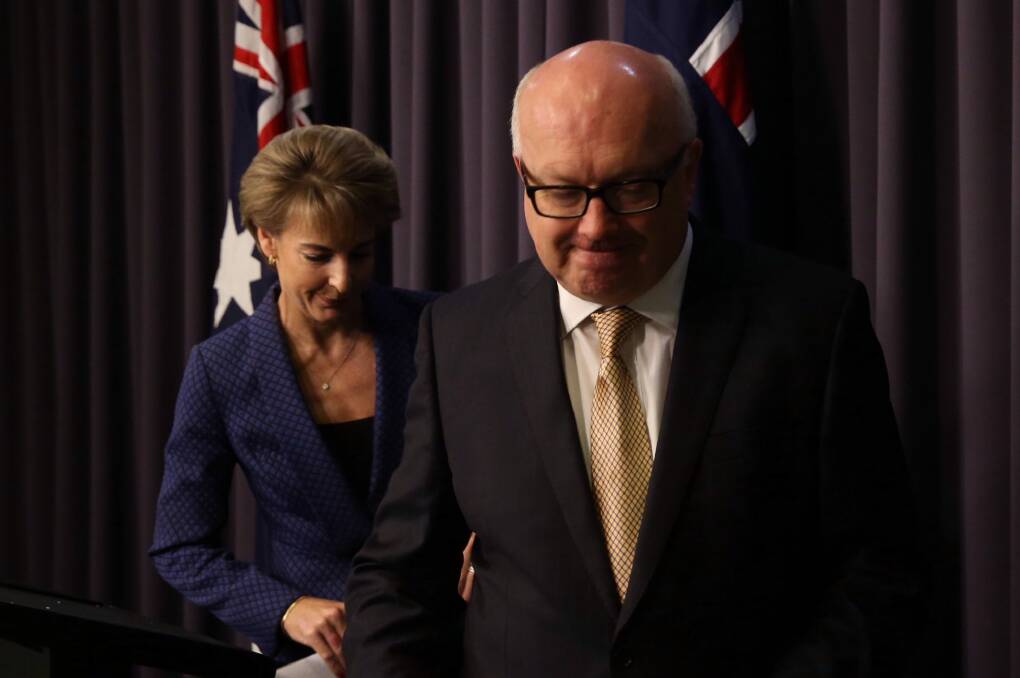 George Brandis and Michaelia Cash announce the cuts reversal on Thursday. Photo: Andrew Meares
