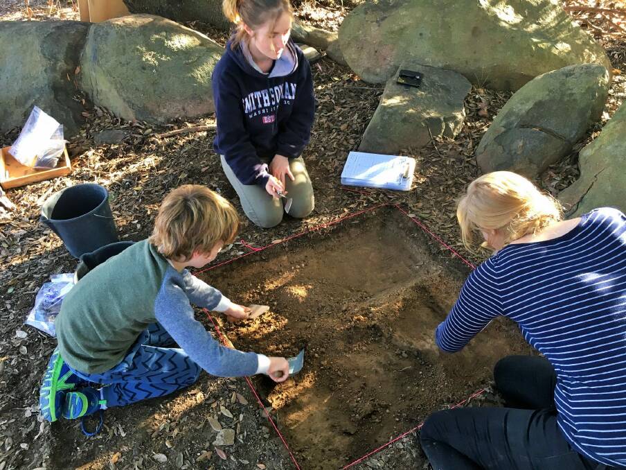 Local residents help out with the recent archaeological dig at the Red Hill camp site.  Photo: Steve Skitmore