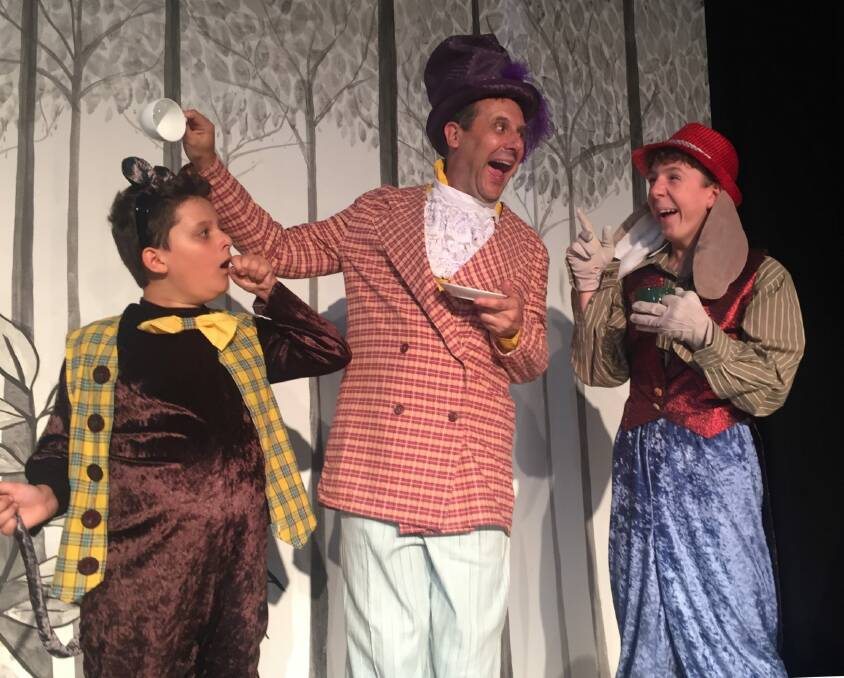 William Best (left) as the Dormouse, Jim Adamik as the Mad Hatter, and Oliver Johnstone as the March Hare in Ickle Pickle's <i>Alice in Wonderland</I>.