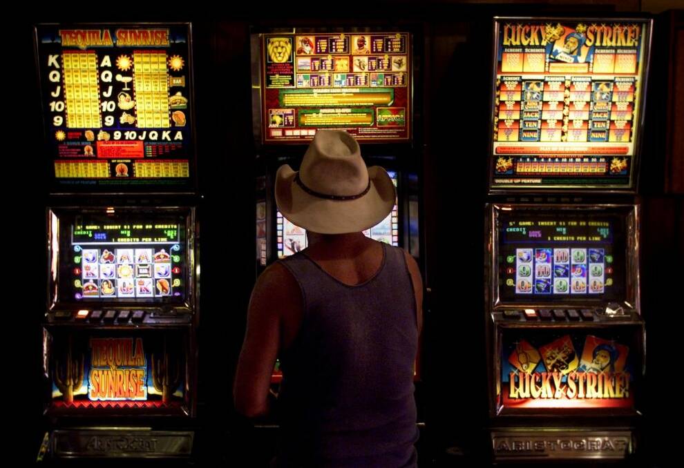 Poker machines: Canberra data shows single men with year 12 or less are most at risk of problem gambling. Photo: Andrew Meares