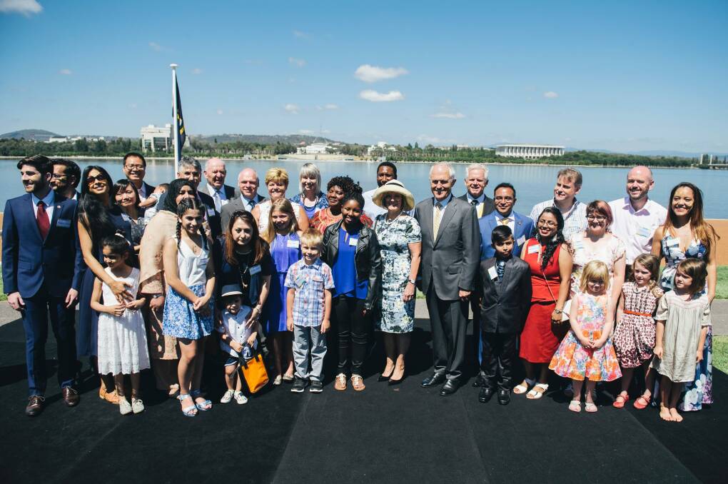 Twenty-eight people from 13 countries were conferred with Australian citizenship in Canberra on Thursday, Prime Minister Malcolm Turnbull leading them in their oath. Photo: Rohan Thomson