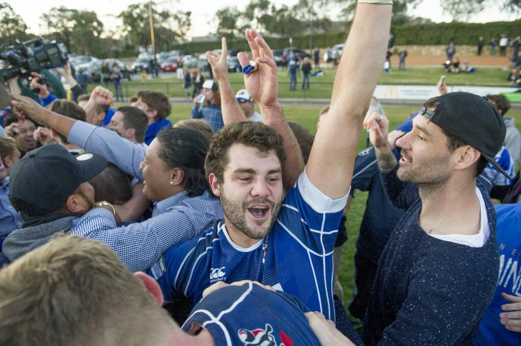 Canberra Royals player Ben Johnston celebrates after the grand final. Photo: Jay Cronan