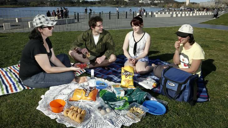 Kate, Luke Corbin, Amy Neve and Fernanda Bowerman enjoy a picnic at Commonwealth Place near Lake Burley Griffin on Sunday. Photo: Jeffrey Chan