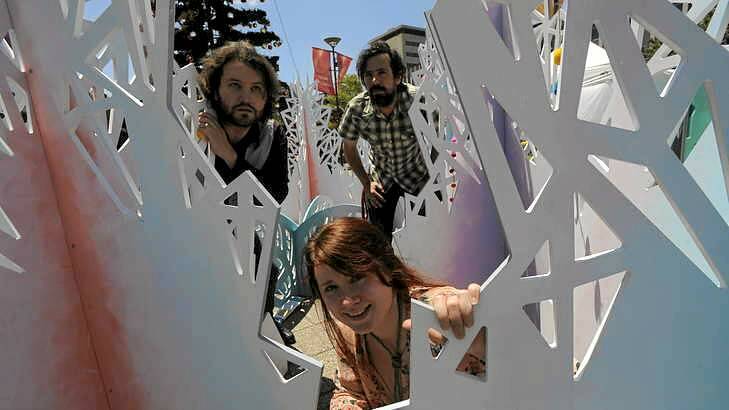 The Tragic Troubadours in Civic Square. Clockwise from bottom, Lauren Harvey, Bela Farkas and Andrew Galan. Photo: Graham Tidy