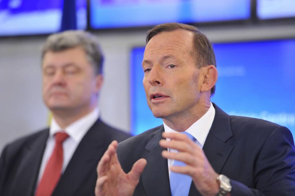 Summer fun: Tony Abbott intends to spend his holiday break grappling with a paid parental leave policy.
