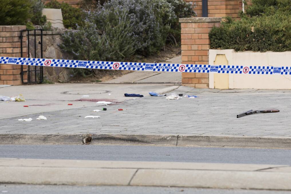 A shotgun lying on a Queanbeyan street where an armed man was shot by police on Saturday morning. Photo: Jamila Toderas