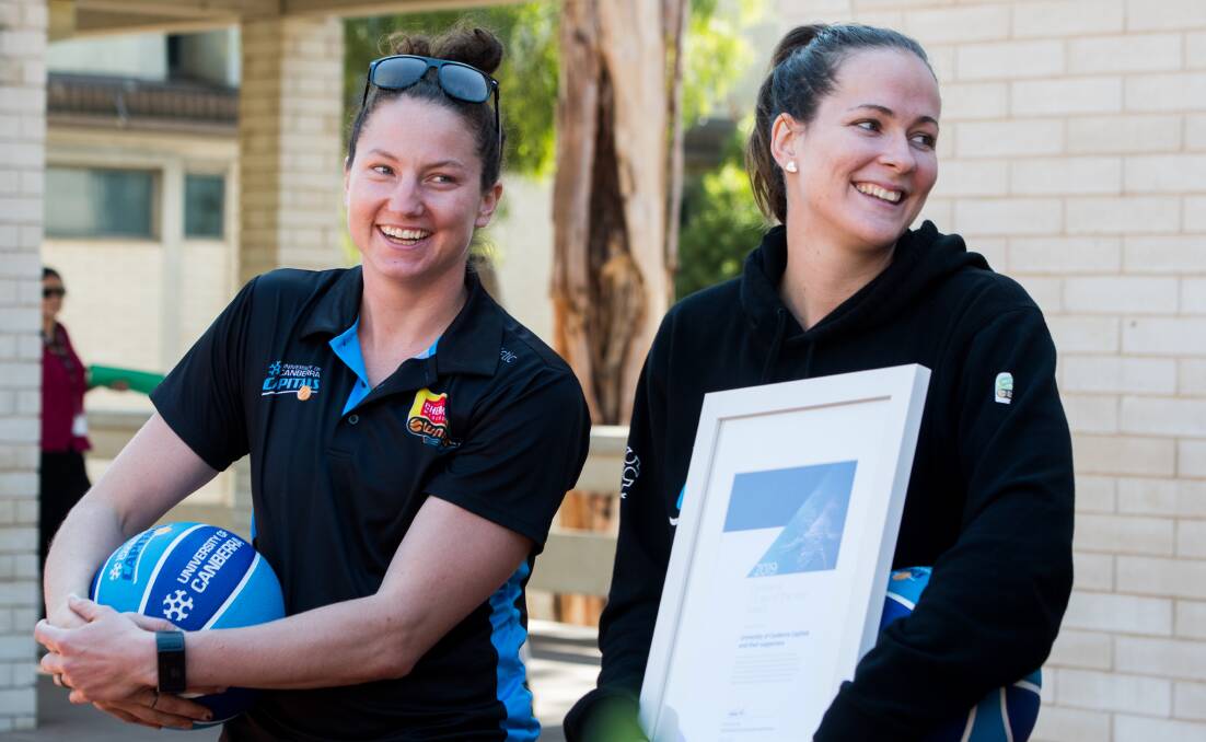 Kelsey Griffin and Keely Froling on hand as the Canberra Capitals are announced as 2019 Canberra Citizen of the year. Photo: Elesa Kurtz
