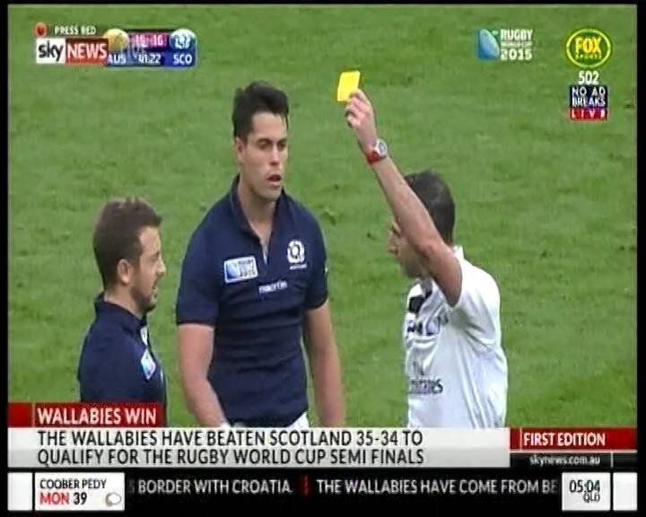 Harsh call: Sean Maitland, centre, receives a yellow card.   Photo: Screen grab: Fox Sports