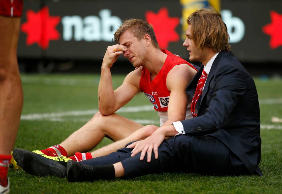 Brothers in arms: Brandon Jack consoles Kieren after the Swans' 2016 grand final loss. Photo: Getty Images