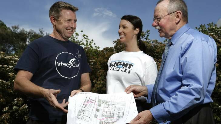 Lifecycle committee chairman Mark Blake with Leukemia Foundation fundraising manager Susan Fisher and John James Foundation CEO Phil Greenwood look over plans for John James Village that will provide residential accommodation for patients undergoing blood cancer treatment. Photo: Jeffrey Chan