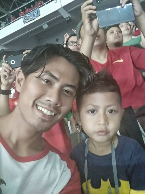 The last photo Wahyu Adilla, with son Xherdan Fachridzi, 4, sent his pregnant wife. They had flown to Jakarta to watch a soccer match. Photo: Supplied