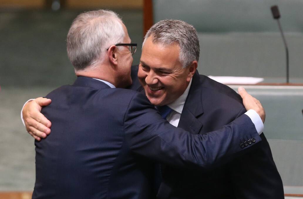 Prime Minister Malcolm Turnbull embraces former treasurer Joe Hockey after Mr Hockey's  valedictory speech.  Photo: Andrew Meares