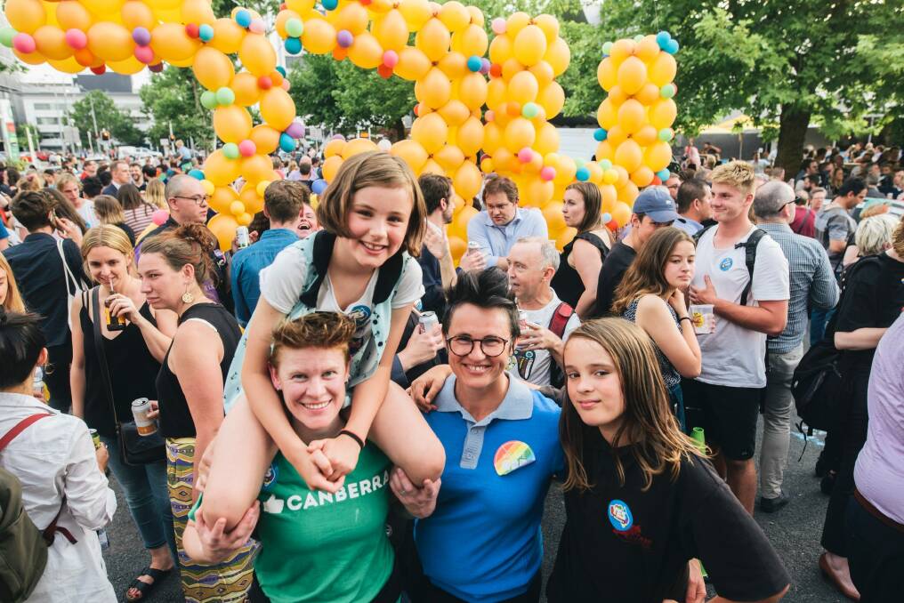 Braddon street party to celebrate the marriage equality vote result. Emma Beer, Kirsten Farrel, and Isla and Xabi Farrel. Photo: Rohan Thomson