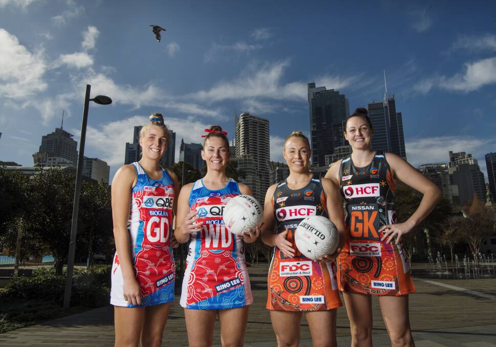Derby: Maddy Turner, Abbey McCulloch, Kim Green and Sam Poolman model the Indigenous dresses the Swifts and Giants will wear this weekend. Photo: Louise Kennerley