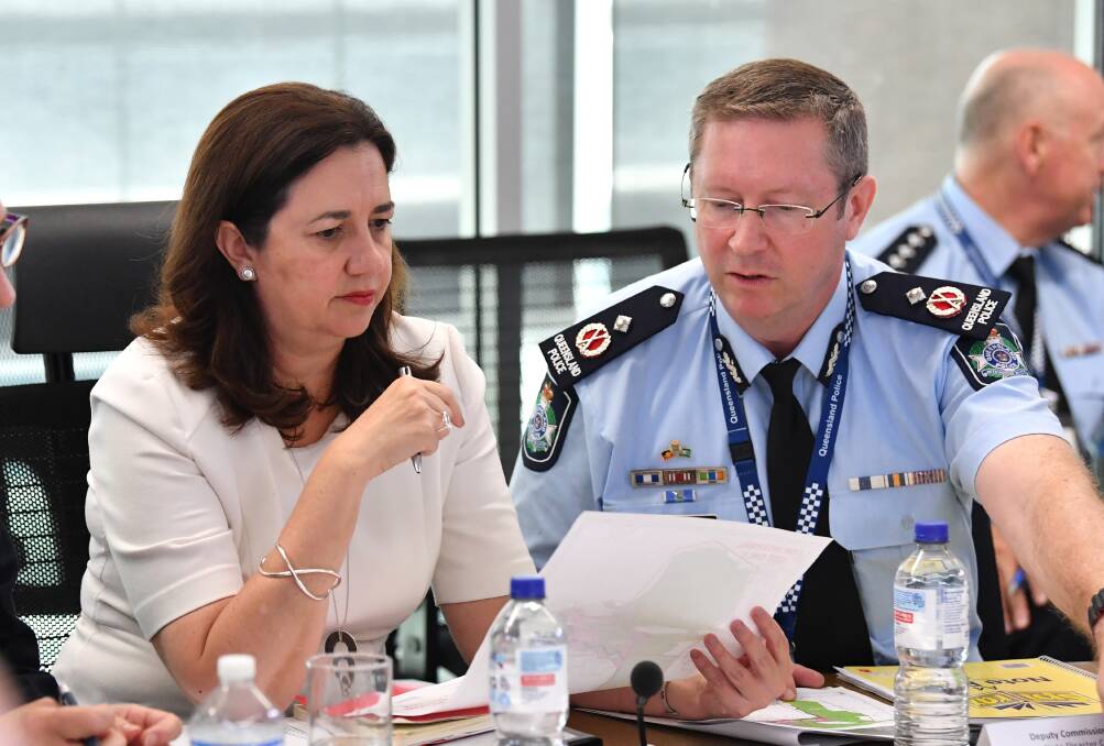 Queensland Premier Annastacia Palaszczuk (left) with Emergency Services deputy commissioner Bob Gee (right) . Photo: AAP