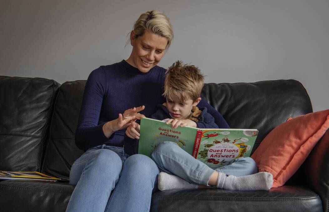 Oran Park's Mary Gabbey and her son Henry, 4, visit the library each week. 'I'm really supportive of more funding going into libraries, they're just so important,' she says. Photo: Louise Kennerley