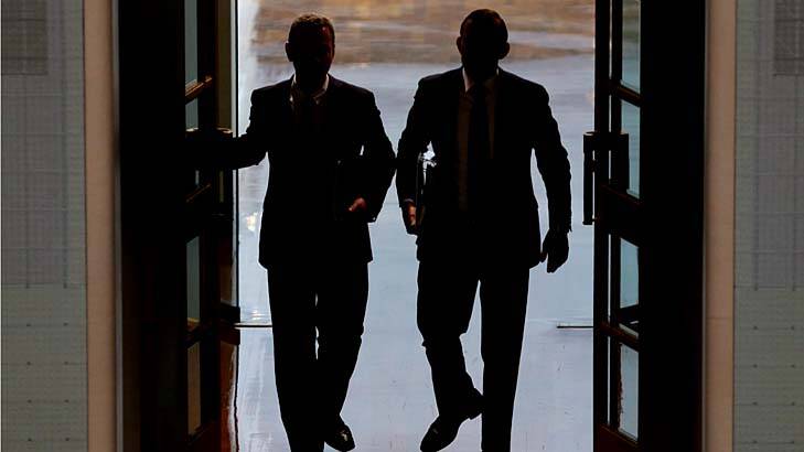 Guess who?: Leaders of the House Christopher Pyne and Prime Minister Tony Abbott enter Parliament for question time on Thursday. Photo: Andrew Meares