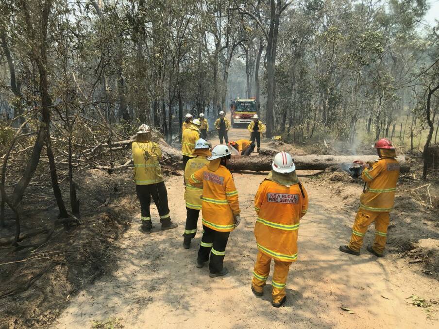 New South Wales Rural Fire Service firefighters battling bushfires on Queensland's central coast Photo: New South Wales Rural Fire Service