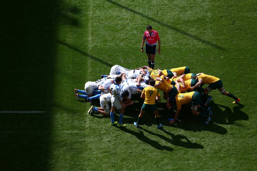 Wallaby Nick Phipps prepares to put the ball into the scrum during the pool A match between Australia and Uruguay in Birmingham on Sunday. Photo: Getty Images