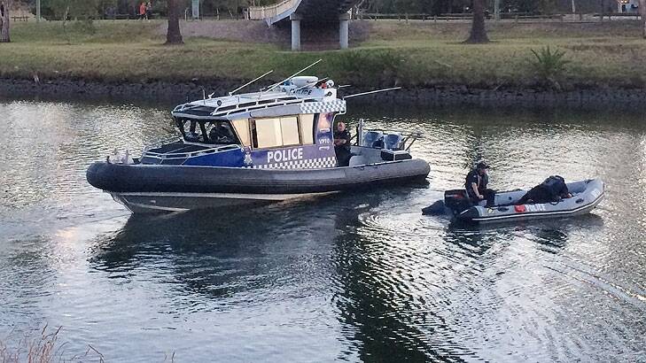 Police search the Maribyrnong River. Photo: Beau Donelly