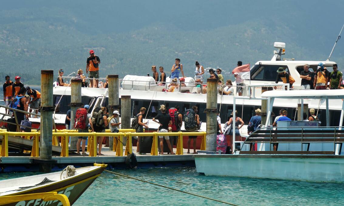 A speedboat drops and picks up tourists at Gili Air harbour.  Photo: Amilia Rosa