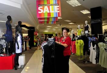 Myer ladies wear team leader Lesley Gendle of Charnwood prepares clothing for the boxing day sales. Photo: Melissa Adams