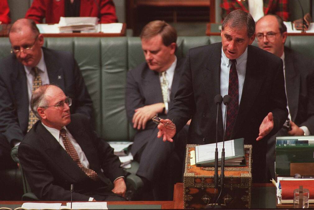 John Fahey with John Howard in Parliament. The then finance minister warned cabinet that Australia was slow to get ready for the millenium bug. Photo: Andrew Meares