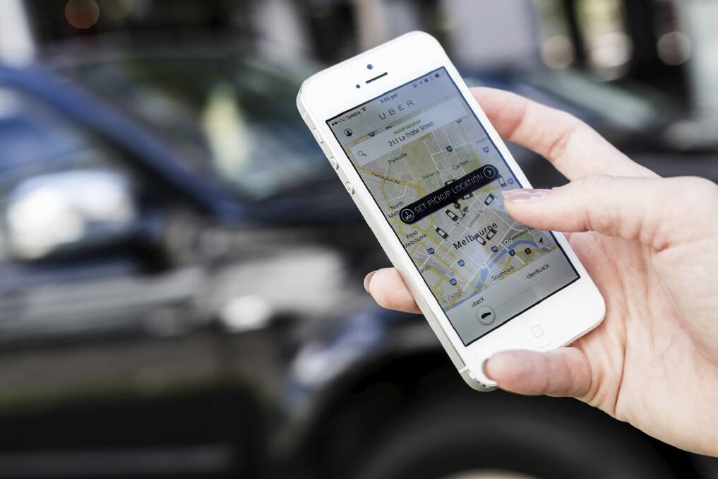 Uber's surge pricing system means the cost of your ride could soar as more and more punters look for a way home once the clock strikes midnight. Photo: Dominic Lorrimer