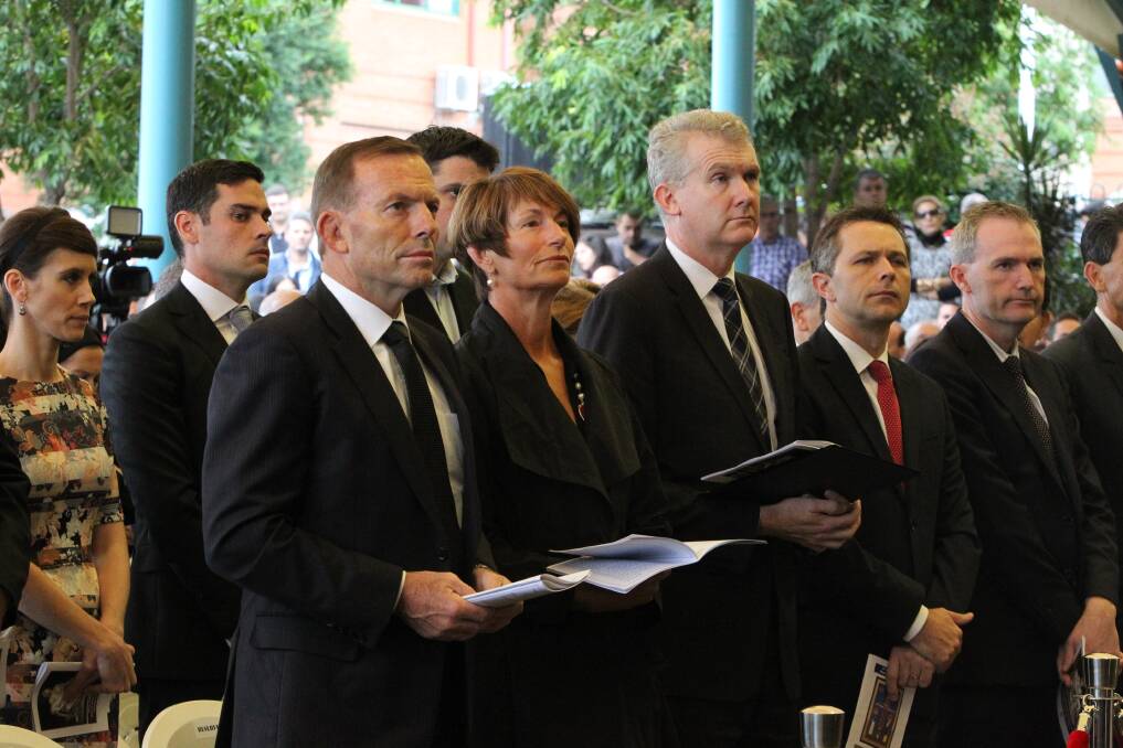 Then-prime minister Tony Abbott attends Good Friday Liturgy in 2015.  Photo: Louise Kennerley 