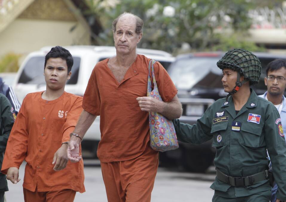 Australian filmmaker James Ricketson is escorted to the Cambodian Supreme Court in Phnom Penh. for a hearing last month. Photo: ap