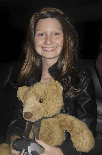 Gungahlin teenager Dainere Anthoney with her teddy bear Theodore.